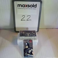 Photo showing two sealed packages of 1997 Batman & Robin trading cards, one pack standing vertically with Batman on the front, the other pack lying flat showing Batman, Robin, and Batgirl.