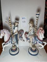 Both figurines side by side showing full view