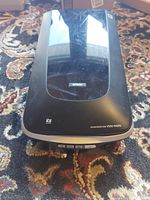 Top view of the Epson Perfection V500 Photo scanner showing the lid, logos, and surface condition