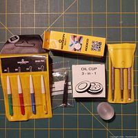 Overview of Bergeon watchmakers tools and accessories including oil cup, Rodico, and multiple tools in yellow pouches.