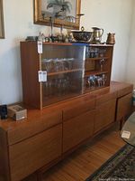 Overall view of buffet base and hutch assembled together, showing wood veneer finish and styling