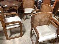 Four chairs grouped together showing overall shape and finish