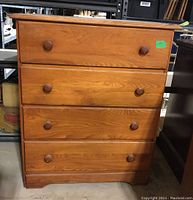 Front view of closed dresser showing overall design and condition