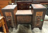 Full frontal view of the rectangular wood veneer vanity table showing six drawers (3 on each side), a central two-door cabinet, decorative feet, and the wood grain with inlaid veneer patterns.