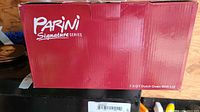 Red box showing Parini Signature Series branding and indication of 7.0 qt Dutch oven with lid.