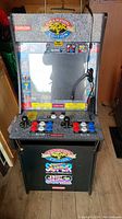 Front view of Champion Street Fighter II Champion Edition arcade cabinet showing game marquee, screen, control panel with joysticks and buttons, and front artwork.