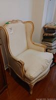 Front view of the upholstered wingback chair