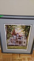 Framed limited edition print showing a Victorian house scene titled "House on Maple Street" by Roger Witmer.