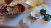 Photo shows a shell-shaped red and cream Royal Winton dish with visible crazing, cream Carlton Ware dish, four small St. Dalfour bowls, and two decorative salt cellars with glass inserts.