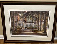 Framed black and brown wood print of a conservatory, signed and numbered by Trisha Romance, showing full view of the artwork and frame.