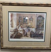Full view of the framed Trisha Romance print showing the woman and child reading scene, frame and matting details visible.