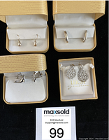 Four pairs of pierced silver earrings from Leigh, each in a separate beige box with white interior, arranged on a black background with a MaxSold lot number 99 card.