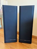 Pair of Kentwood JL-506 speakers front view with black grills and rectangular shape.