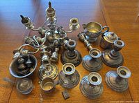 Overview of all sterling silver parts on wood table