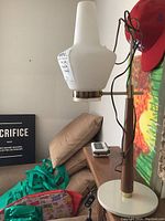 Overall view of lamp showing shade, post and base in room setting