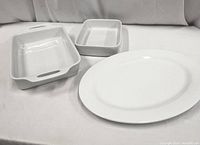 Photo showing the set of three white ceramic bakeware pieces: two rectangular casserole dishes and one oval platter