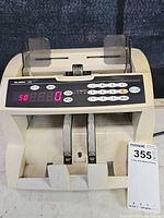 Front view of Glory GFB bill counter showing LED display and keypad