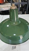 Front angled view of green enamel street or industrial style light shade, showing glossy finish and fixture mount.