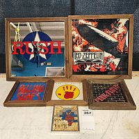 Full view of seven framed rock images laid out, showing Rush mirror, Led Zeppelin print, Rolling Stones logo, Pink Floyd designs with wooden frames.