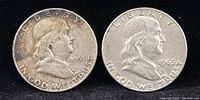 Obverse side of 1951 and 1963 Franklin Half Dollars showing profile of Benjamin Franklin with date and Liberty inscriptions.