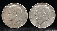 Obverse view of both Kennedy half dollars showing Kennedy's profile and years 1966 and 1967.