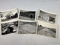 Overview of six original 5x7 photos showing various earthquake damage scenes including infrastructure and land cracks.