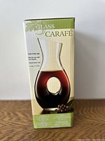 Image of the carafe box showing the carafe filled with dark liquid