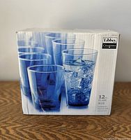 Box showing the Libbey Charisma branding, blue glasses with water and ice pictured, quantity of 12 noted.