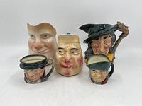 Front view of 5 vintage Doulton character jugs arranged in a line showing different character faces and details.