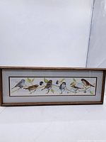 Full view of the framed watercolour painting depicting seven sparrows on branches with leaves.