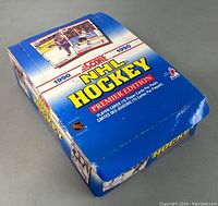 Blue display box showing external packaging of 1990 Score NHL Hockey Premier Edition cards.