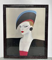 Framed vintage poster showing the full artwork of a lady with a large hat, red lipstick, in art deco style.