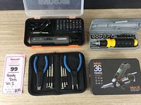 Four tool kits displayed including Kelvin 36 electric screwdriver set, multi-bit driver set, socket driver set, and precision pliers with screwdrivers