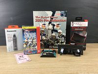 Full view showing all items in lot arranged on wood surface.