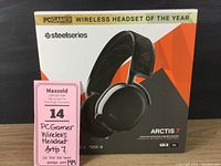 Box front showing SteelSeries Arctis 7 wireless headset with PCGamer endorsement and branding.