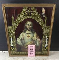 Full view of shadow box shrine showing wooden frame, stencil glass artwork with religious imagery, and Jesus cutout with red velvet background. Pink tag visible in front.