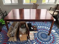 Front view of table showing full rectangular top and legs