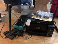 Epson ET-3750 printer, Logitech MK320 keyboard in box, LED lamp and mouse visible