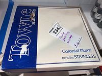 Box top with Towle Silversmiths logo and 'Colonial Plume 40 Pc. Set Stainless' text