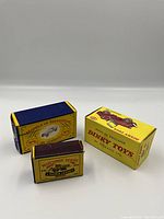 Three cardboard boxes: Matchbox Models of Yesteryear No.6, Matchbox Series, Dinky Toys Universal Jeep