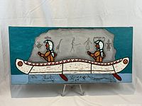 Full front view of the painting on an easel against a white backdrop