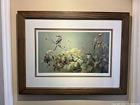 Full view of framed print on wall showing overall appearance and scale