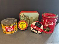 Front view of all five vintage tins arranged together to show variety and designs