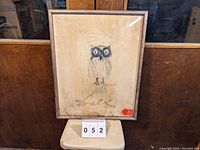 Framed Salvador Dali owl print showing full artwork and framing.