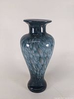 Front view of a mottled cased art glass vase, showing flared rim, mottled blue and gray coloration, glossy finish