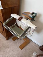 Full view of the Puritan portable rug frame with attached hand crank machine