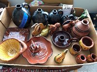 Overview of all 21 assorted pottery pieces in cardboard tray