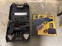 Kingcraft delta sander inside original black plastic carrying case with accessories and instruction manual, alongside original product box for the variable speed delta sander