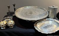 Photo showing the large pedestal platter, rectangular dish, creamer, sugar bowl, candlesticks, and flask
