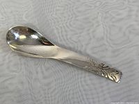 Full view of the 4.5 inch sterling silver spoon showing overall shape and design